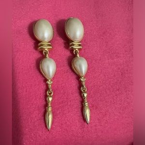 Gold tone, clip on earrings.